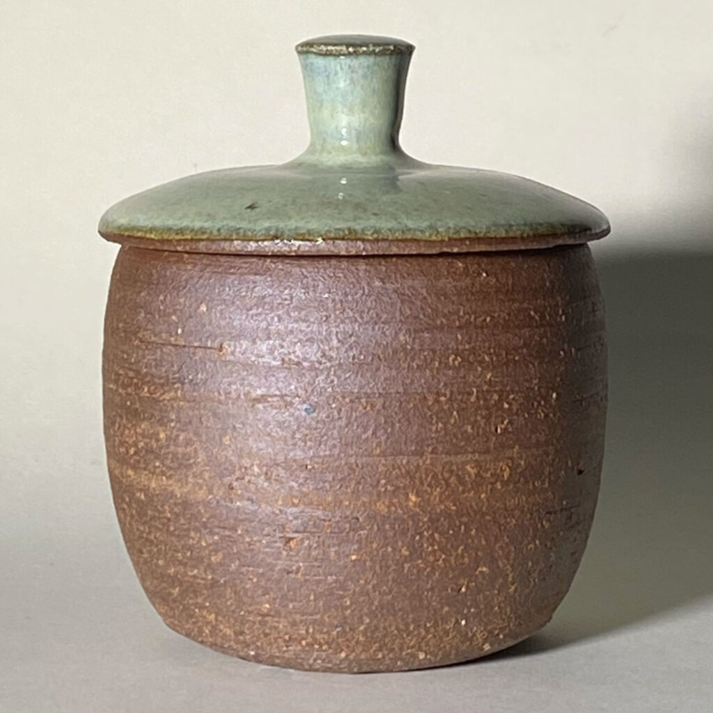 hand-made stoneware jar with a glazed lid