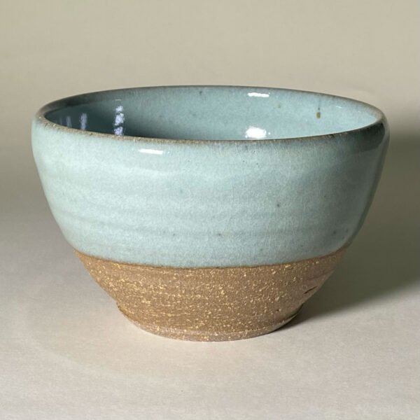 hand made earthenware ceramic bowl with a pale blue glaze